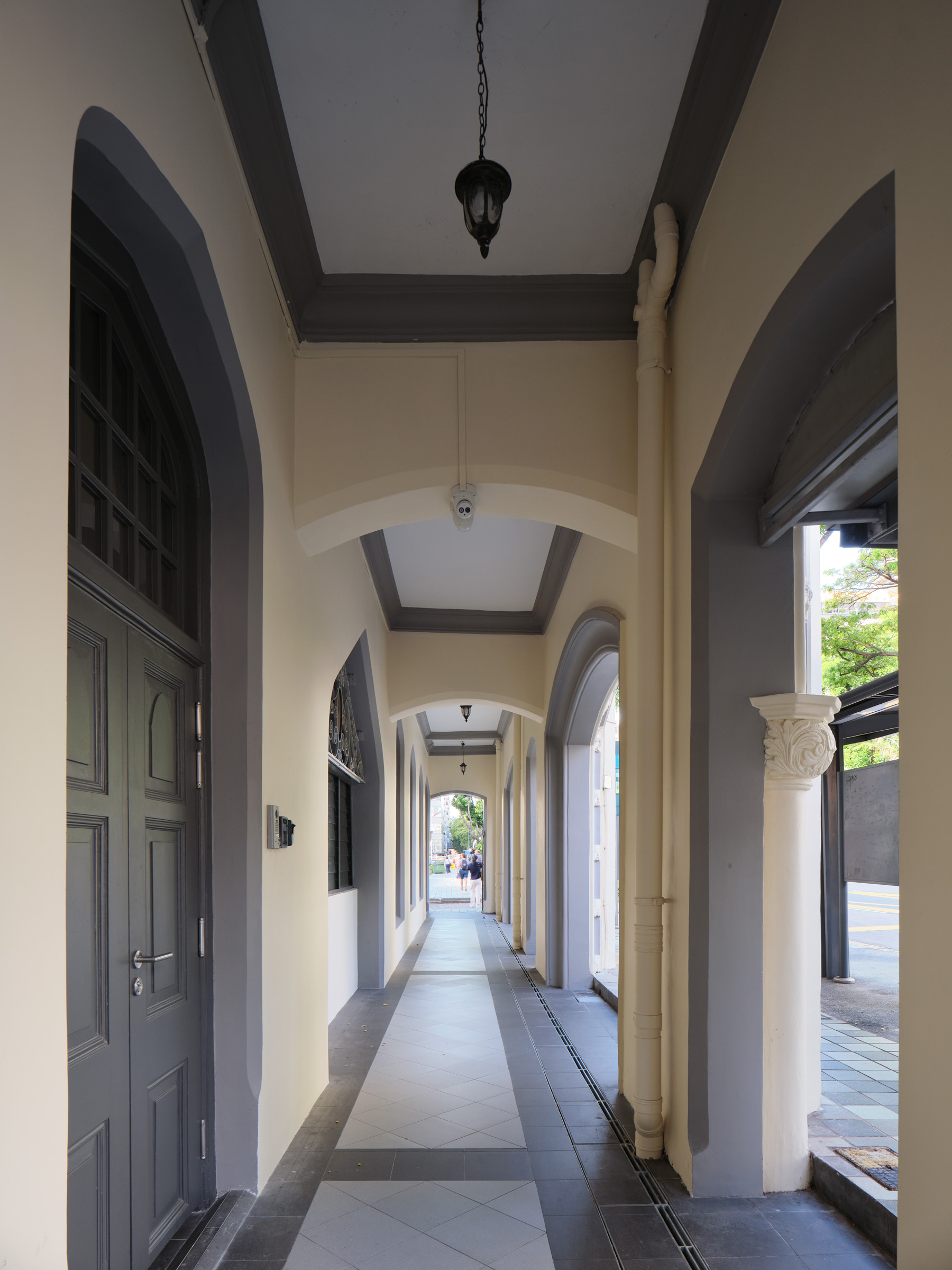 The five-foot way along Victoria Street was restored and raised to address the periodic flooding 