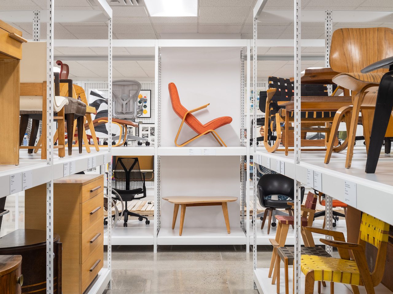 View of the furniture racking. This aisle showcases pieces from the 1930s-1940s, including the Grasshopper Chair by Eero Saarinen, 1946 (above) and Amoeba Coffee Table by Jens Risom, 1943 (below).