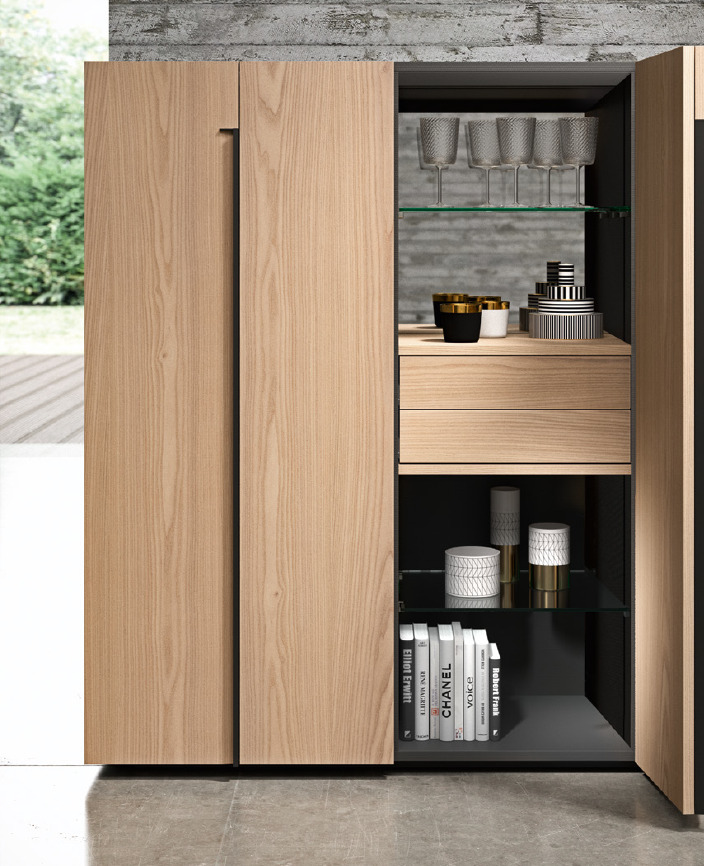 This tall unit blends easily in the kitchen as in the living room where it turns into a bar cabinet