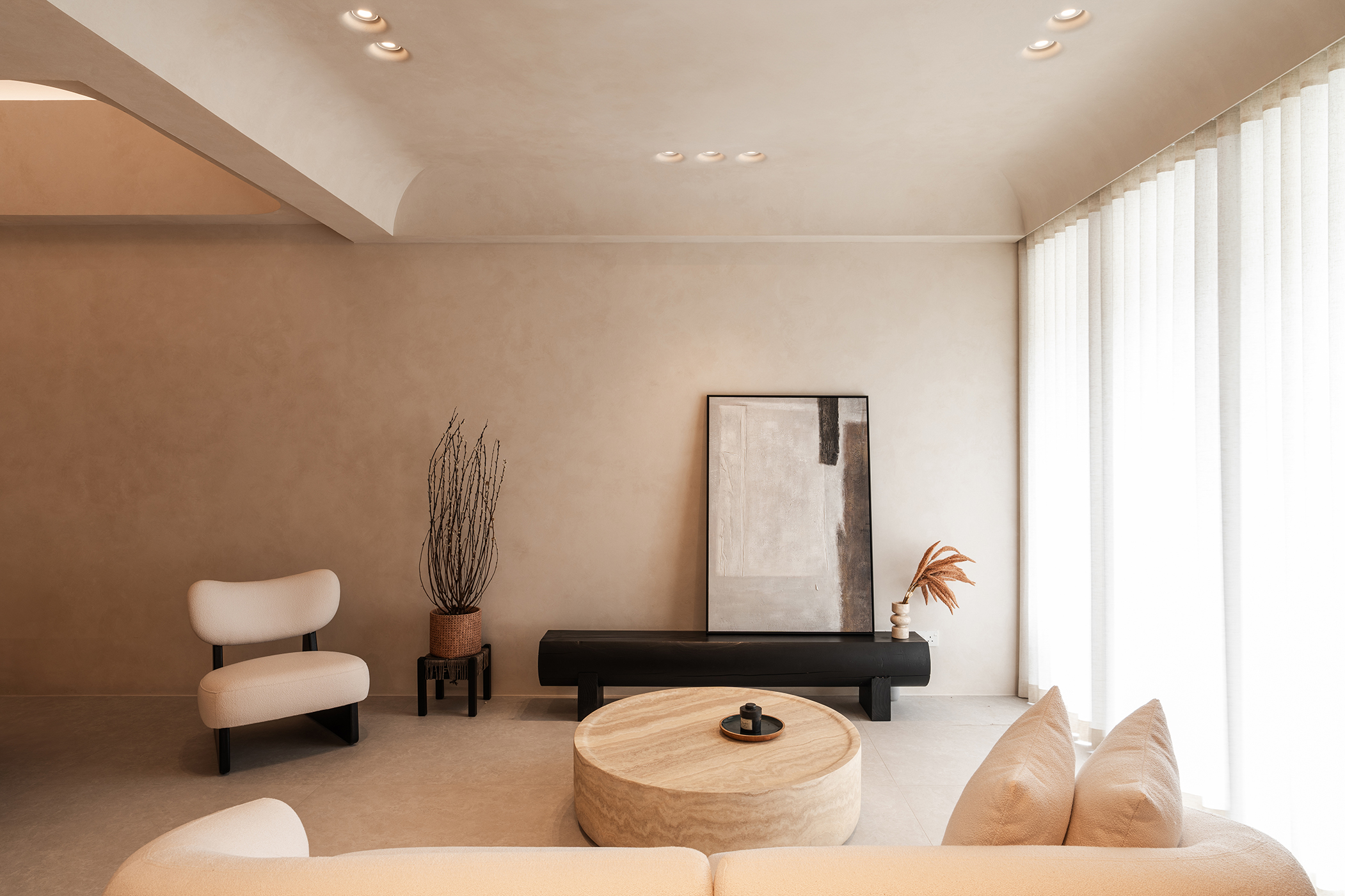 The Halo Gypsum lights, embedded seamlessly into the ceiling, create a soft, ambient glow that enhances the serene atmosphere of the living space.