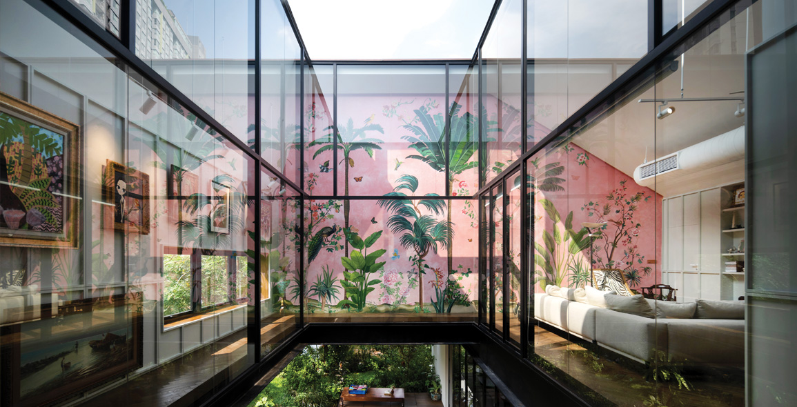 Beautiful pink, botanical themed mural complements the lush greenery in and around the home.