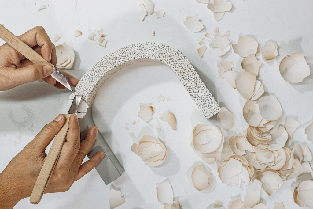 The Nature Squared surfaces are handcrafted using eggshells or seashells.