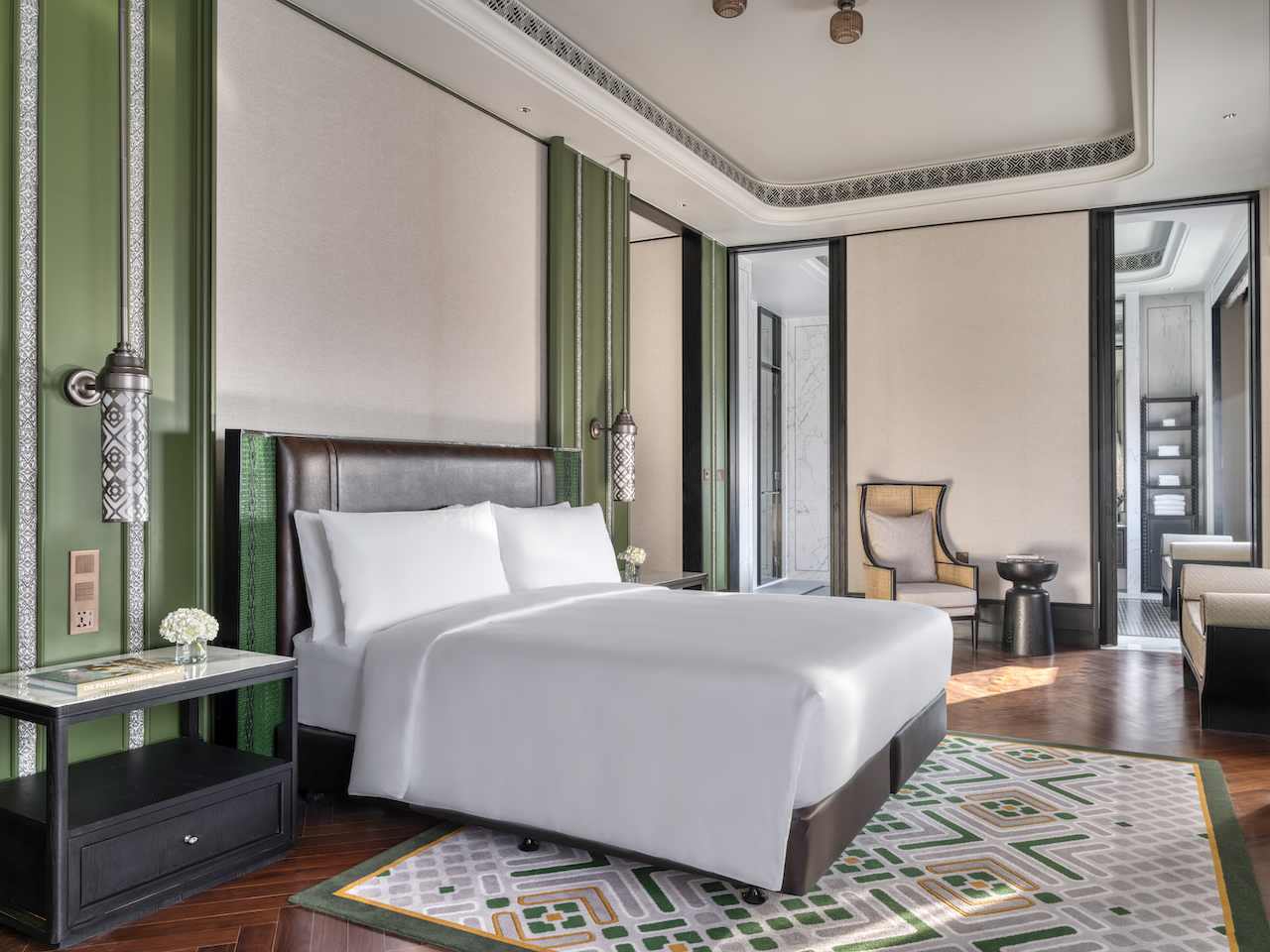 The Presidential Suite also features Lanna-inspired décor with bespoke finishes using traditional techniques such as wood carving and metal beating.
