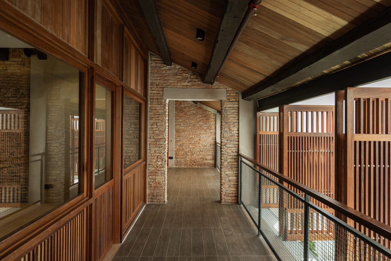 Currently this naturally ventilated corridor, overlooking the open courtyard, is a space for users to take respite from the activities within the adjacent rooms.