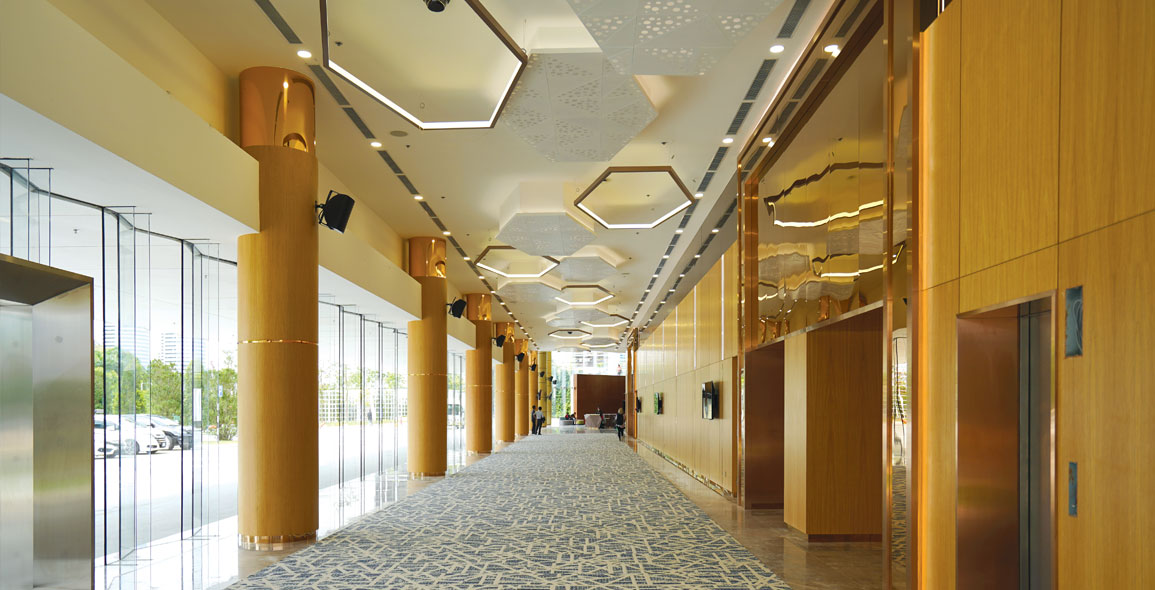 Textural plays of carpet, ceiling and wall panelling inject colour and movement into conference centre and office interiors.